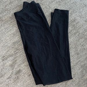 American apparel shiny leggings in black. Size medium